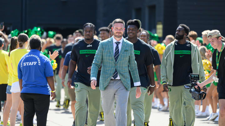 Aug 31, 2024; Eugene, Oregon, USA; Oregon Ducks head coach Dan Lanning leads the team into the stadium before the game against the Idaho Vandals at Autzen Stadium.