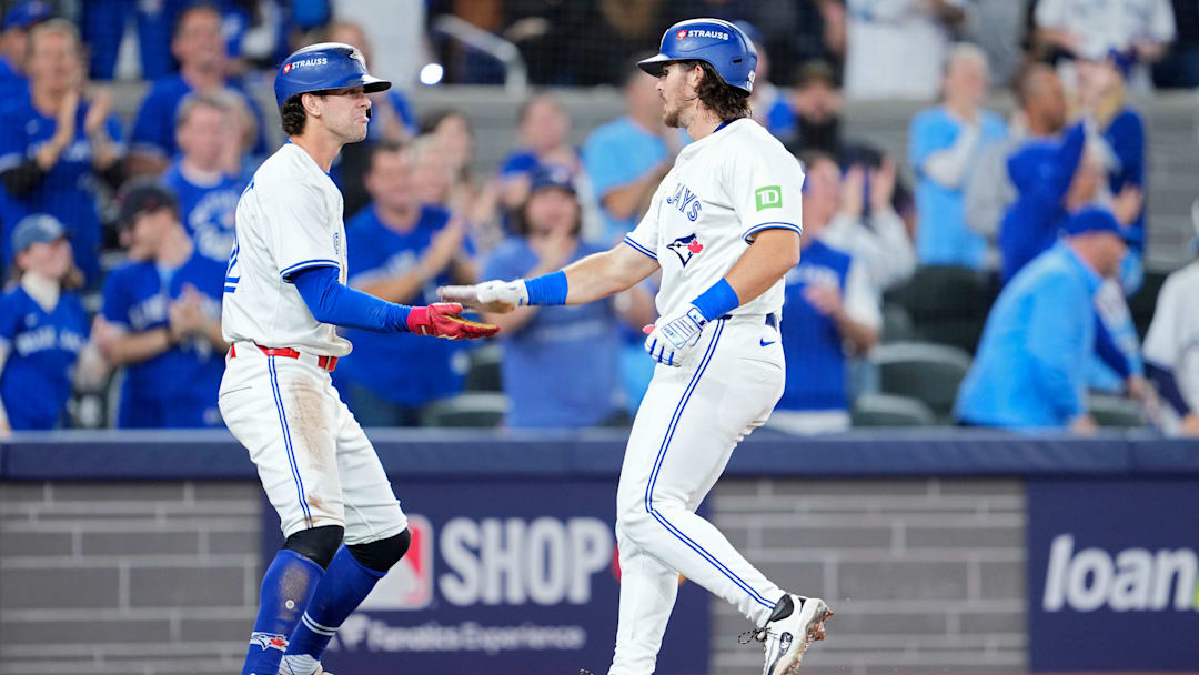 Ernie Clement (left) and Addison Barger's (right) versatility in the field has given the Toronto Blue Jays more flexibility this offseason.