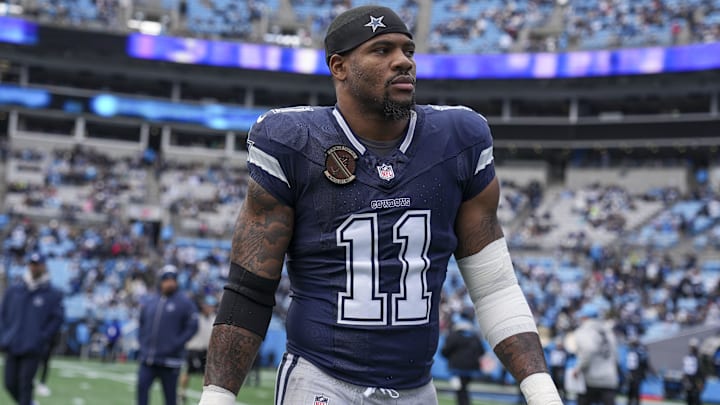 Dallas Cowboys linebacker Micah Parsons walks onto the field during the first quarter against the Carolina Panthers at Bank of America Stadium.