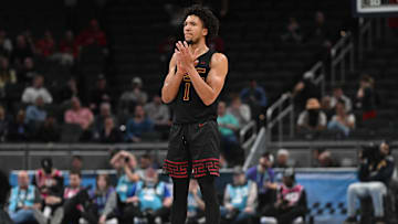 Mar 12, 2025; Indianapolis, IN, USA; USC Trojans guard Desmond Claude (1) celebrates after a play during the second half against the Rutgers Scarlet Knights at Gainbridge Fieldhouse. Mandatory Credit: Robert Goddin-Imagn Images