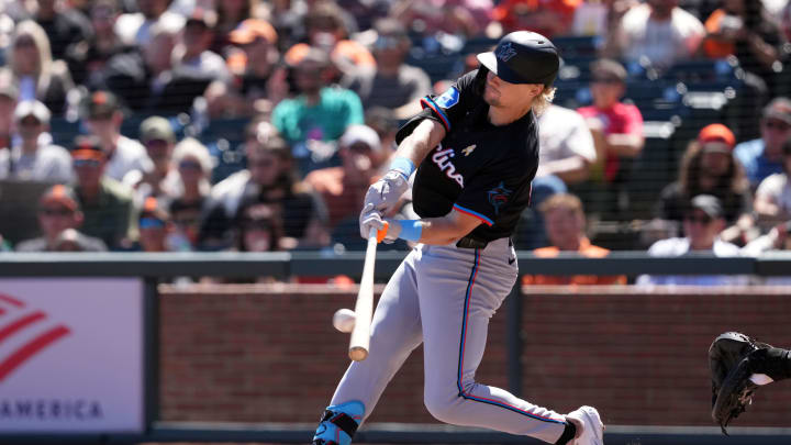 Sep 1, 2024; San Francisco, California, USA; Miami Marlins left fielder Kyle Stowers (28) hits a home run against the San Francisco Giants during the fifth inning at Oracle Park. Mandatory Credit: Darren Yamashita-USA TODAY Sports