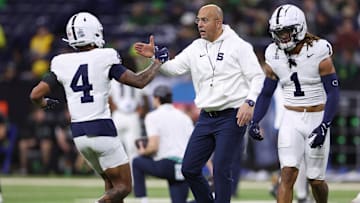 Penn State Nittany Lions wide receiver Tyseer Denmark high-fives  head coach James Franklin during warmups prior to the Big Ten Championship Game vs. Oregon.