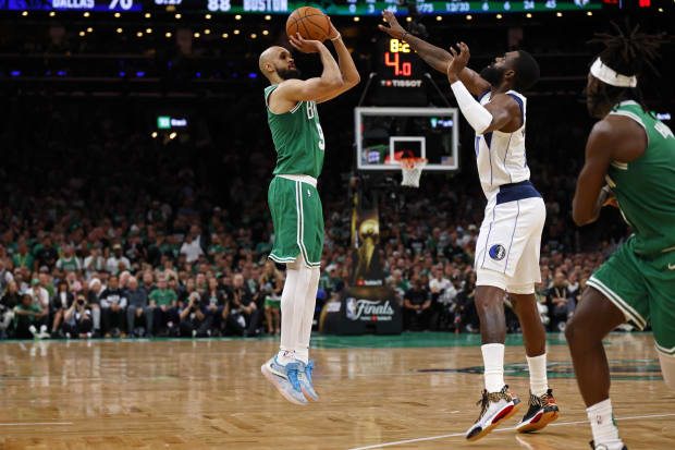 Boston Celtics guard Derrick White shoots a three in Game 5 of the 2024 NBA Finals.
