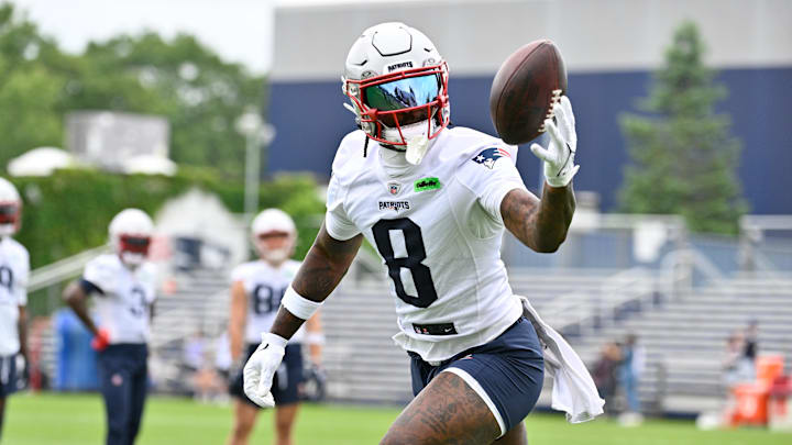 New England Patriots wide receiver Stefon Diggs tries to catch the ball during minicamp at Gillette Stadium.
