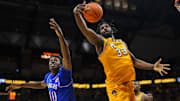 Dec 8, 2024; Columbia, Missouri, USA; Missouri Tigers center Josh Gray (33) grabs a rebound against Kansas Jayhawks forward Flory Bidunga (40) during the second half at Mizzou Arena. Mandatory Credit: Jay Biggerstaff-Imagn Images