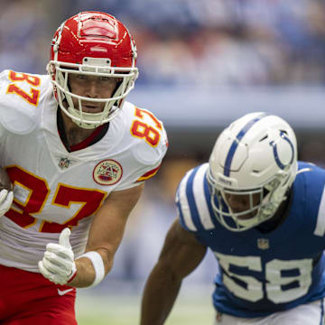 Sep 25, 2022; Indianapolis, Indiana, USA; Kansas City Chiefs tight end Travis Kelce (87) runs toward the end zone away from Indianapolis Colts linebacker Bobby Okereke (58) during the first quarter at Lucas Oil Stadium. Mandatory Credit: Marc Lebryk-Imagn Images
