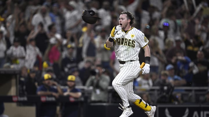 San Diego Padres second baseman Jake Cronenworth (9) tosses his helmet after hitting a walk-off home run during the ninth inning against the Milwaukee Brewers at Petco Park on June 20.