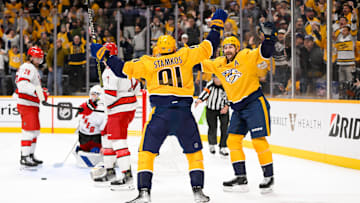 Dec 23, 2024; Nashville, Tennessee, USA;  Nashville Predators center Steven Stamkos (91) celebrates his goal with left wing Filip Forsberg (9) against the Carolina Hurricanes during the first period at Bridgestone Arena. Mandatory Credit: Steve Roberts-Imagn Images