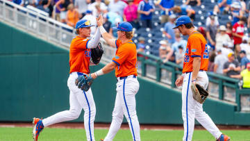 Jun 17, 2024; Omaha, NE, USA; Florida Gators third baseman Dale Thomas (1) and left fielder Tyler Shelnut (6) celebrate after defeating the NC State Wolfpack at Charles Schwab Field Omaha. Mandatory Credit: Dylan Widger-USA TODAY Sports