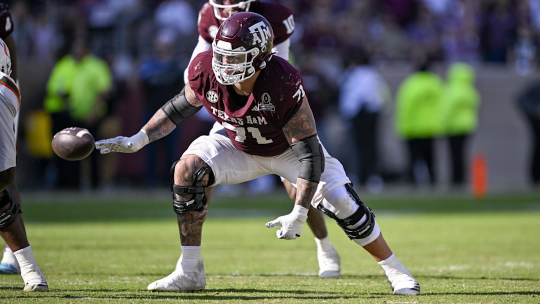 Texas A&M Aggies offensive lineman Chase Bisontis (71) blocks the rush during the game between the Aggies and the Hurricanes at Kyle Field.