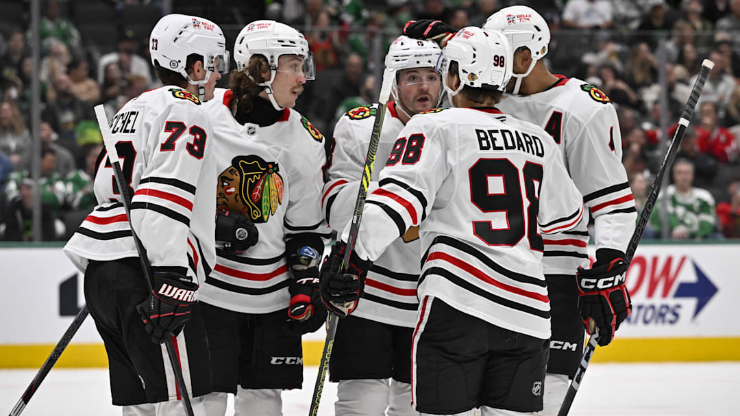 Nov 7, 2024; Dallas, Texas, USA; Chicago Blackhawks left wing Tyler Bertuzzi (59) and left wing Lukas Reichel (73) and center Connor Bedard (98) and center Ryan Donato (8) and defenseman Connor Murphy (5) celebrates a goal scored by Bertuzzi against the Dallas Stars during the third period at the American Airlines Center. Mandatory Credit: Jerome Miron-Imagn Images