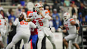 Nov 1, 2025; Lawrence, Kansas, USA; Oklahoma State Cowboys quarterback Zane Flores (6) throws a pass during the second half against the Kansas Jayhawks at David Booth Kansas Memorial Stadium. Mandatory Credit: Jay Biggerstaff-Imagn Images