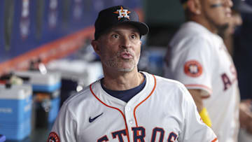 Jun 28, 2025; Houston, Texas, USA; Houston Astros manager Joe Espada (19) looks on in the dugout before the game against the Chicago Cubs at Daikin Park. Mandatory Credit: Troy Taormina-Imagn Images