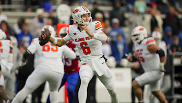 Nov 1, 2025; Lawrence, Kansas, USA; Oklahoma State Cowboys quarterback Zane Flores (6) throws a pass during the second half against the Kansas Jayhawks at David Booth Kansas Memorial Stadium. Mandatory Credit: Jay Biggerstaff-Imagn Images