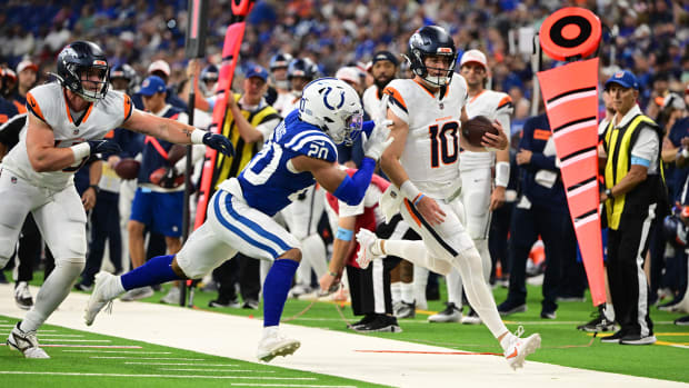 Aug 11, 2024; Indianapolis, Indiana, USA;  Denver Broncos quarterback Bo Nix (10) is pushed out of bounds by Colts safety