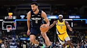 Apr 11, 2025; Indianapolis, Indiana, USA; Orlando Magic guard Caleb Houstan (2) drives the ball past Indiana Pacers forward Jarace Walker (5) during the second half at Gainbridge Fieldhouse. Mandatory Credit: Marc Lebryk-Imagn Images