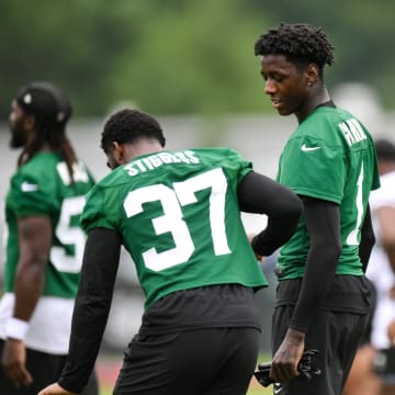 Jul 25, 2024; Florham Park, NJ, USA; New York Jets cornerback Sauce Gardner (1) talks with cornerback Qwan'tez Stiggers (37) during training camp at Atlantic Health Jets Training Center. 