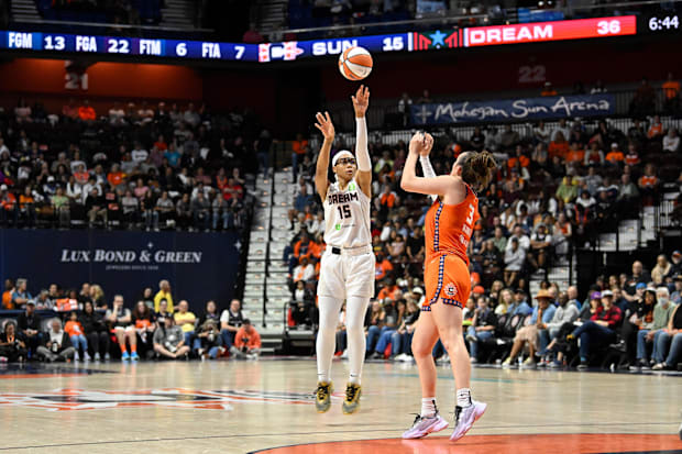 Atlanta Dream guard Allisha Gray shoots over Connecticut Sun guard Marina Mabrey. 