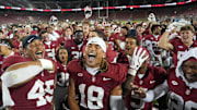 Sep 13, 2025; Stanford, California, USA; Stanford Cardinal players celebrate on the field after defeating the Boston College Eagles at Stanford Stadium. Mandatory Credit: Darren Yamashita-Imagn Images