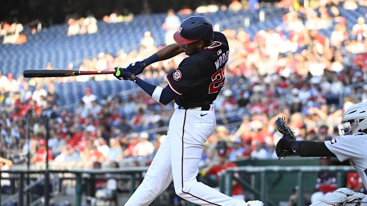 Washington Nationals left fielder James Wood (29) singles against the Detroit Tigers during the first inning at Nationals Park.