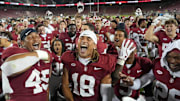 Sep 13, 2025; Stanford, California, USA; Stanford Cardinal players celebrate on the field after defeating the Boston College Eagles at Stanford Stadium. Mandatory Credit: Darren Yamashita-Imagn Images