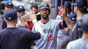 Minnesota Twins center fielder Byron Buxton gets high fives in the dugout after hitting a home run against the Atlanta Braves during the seventh inning at Truist Park in Cumberland, Ga., on April 20, 2025.