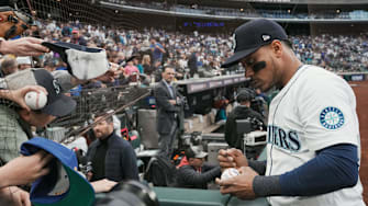 Oct 16, 2025; Seattle, Washington, USA; Seattle Mariners designated hitter Jorge Polanco (7) signs autographs prior to game four of the ALCS round against the Toronto Blue Jays for the 2025 MLB playoffs at T-Mobile Park. Mandatory Credit: Stephen Brashear-Imagn Images