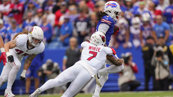 Sep 8, 2024; Orchard Park, New York, USA; Arizona Cardinals linebacker Kyzir White (7) tackles Buffalo Bills running back James Cook (4) during the second half at Highmark Stadium. 