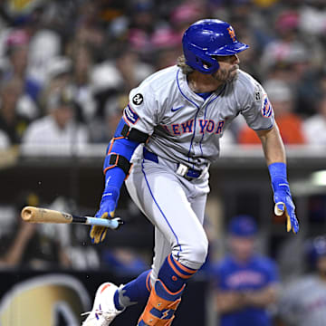 Aug 22, 2024; San Diego, California, USA; New York Mets right fielder Jeff McNeil (1) hits an RBI single against the San Diego Padres during the fourth inning at Petco Park. Mandatory Credit: Orlando Ramirez-Imagn Images