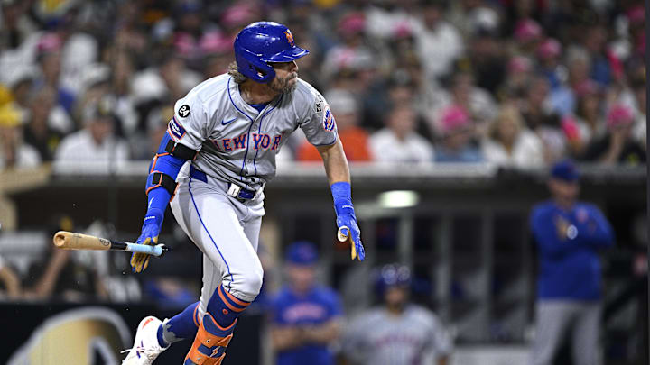 Aug 22, 2024; San Diego, California, USA; New York Mets right fielder Jeff McNeil (1) hits an RBI single against the San Diego Padres during the fourth inning at Petco Park. Mandatory Credit: Orlando Ramirez-Imagn Images