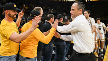 Nov 7, 2025; Iowa City, Iowa, USA; Iowa Hawkeyes head coach Ben McCollum reacts with fans after the game against the Western Illinois Leathernecks at Carver-Hawkeye Arena. Mandatory Credit: Jeffrey Becker-Imagn Images