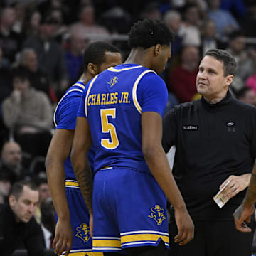McNeese State Cowboys head coach Wade talks with his players during the first half against the Clemson Tigers at Amica Mutual Pavilion. 