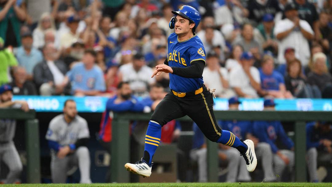 Aug 21, 2026; Seattle, Washington, USA; Seattle Mariners second baseman Cole Young (2) scores a run against the Chicago Cubs during the second innning at T-Mobile Park. Mandatory Credit: Steven Bisig-Imagn Images