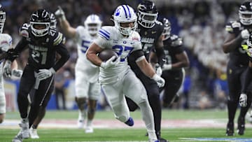 Dec 28, 2024; San Antonio, TX, USA; Brigham Young Cougars running back LJ Martin (27) runs with the ball during the fourth quarter against the Colorado Buffaloes at Alamodome. Mandatory Credit: Troy Taormina-Imagn Images