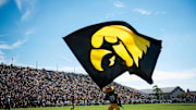 Sep 27, 2014; West Lafayette, IN, USA; The Iowa Hawkeyes mascot waves the Iowa flag in the end zone after a touchdown against the Purdue Boilermakers during the second half of the game at Ross Ade Stadium . The Iowa Hawkeyes beat the Purdue Boilermakers 24 to 10. Mandatory Credit: Marc Lebryk-Imagn Images
