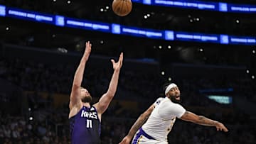 Oct 26, 2024; Los Angeles, California, USA; Sacramento Kings forward Domantas Sabonis (11) attempts get the rebound against Los Angeles Lakers forward Anthony Davis (3) during the first half at Crypto.com Arena. Mandatory Credit: Jonathan Hui-Imagn Images