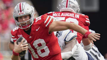 Aug 31, 2024; Columbus, OH, USA; Ohio State Buckeyes quarterback Will Howard (18) scrambles out of the pocket during the NCAA football game against the Akron Zips at Ohio Stadium. Ohio State won 52-6.