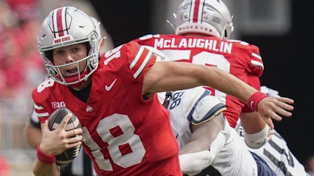 Aug 31, 2024; Columbus, OH, USA; Ohio State Buckeyes quarterback Will Howard (18) scrambles out of the pocket during the NCAA