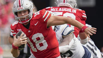Aug 31, 2024; Columbus, OH, USA; Ohio State Buckeyes quarterback Will Howard scrambles out of the pocket during a game against the Akron Zips at Ohio Stadium. Ohio State won 52-6.
