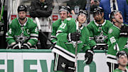 Dallas Stars players look on as forward Jamie Benn’s goal against the Utah Hockey Club is under review.
