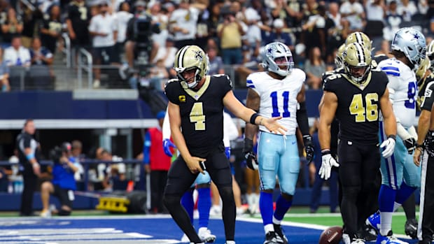  New Orleans Saints quarterback Derek Carr (4) celebrates after scoring a touchdown  during the first half against the Dallas