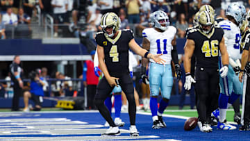 Sep 15, 2024; Arlington, Texas, USA; New Orleans Saints quarterback Derek Carr (4) celebrates after scoring a touchdown  during the first half against the Dallas Cowboys at AT&T Stadium. Mandatory Credit: Kevin Jairaj-Imagn Images