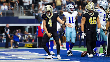 Sep 15, 2024; Arlington, Texas, USA; New Orleans Saints quarterback Derek Carr (4) celebrates after scoring a touchdown  during the first half against the Dallas Cowboys at AT&T Stadium. Mandatory Credit: Kevin Jairaj-Imagn Images