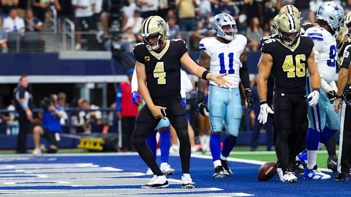 Sep 15, 2024; Arlington, Texas, USA; New Orleans Saints quarterback Derek Carr (4) celebrates after scoring a touchdown  during the first half against the Dallas Cowboys at AT&T Stadium. Mandatory Credit: Kevin Jairaj-Imagn Images