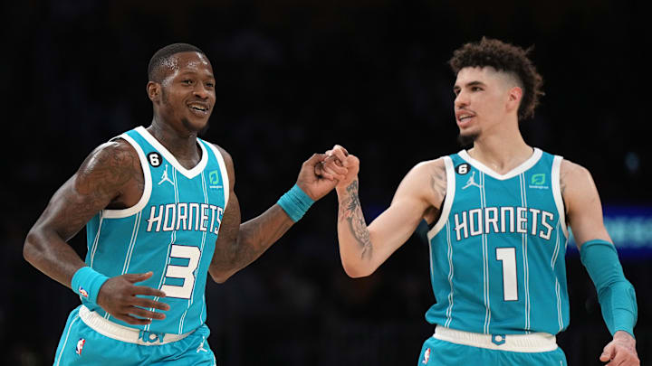 Dec 23, 2022; Los Angeles, California, USA; Charlotte Hornets guard Terry Rozier (3) celebrates with guard LaMelo Ball (1) after a three-point basket in the second half against the Los Angeles Lakers at Crypto.com Arena. The Hornets defeated the Lakers 134-130. Mandatory Credit: Kirby Lee-Imagn Images