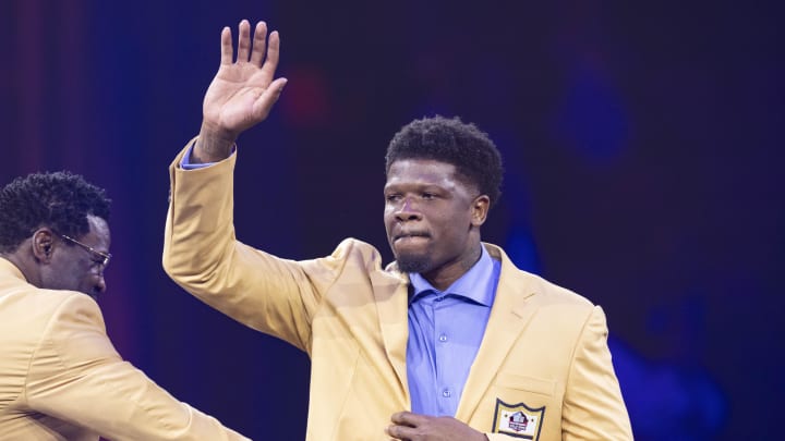 Aug 2, 2024; Canton, OH, USA; Andre Johnson waves to the crowd after receiving his gold jacket at the 2024 Pro Football Hall of Fame Enshrines gold jacket dinner at Canton Memorial Civic Center. Mandatory Credit: Scott Galvin-USA TODAY Sports