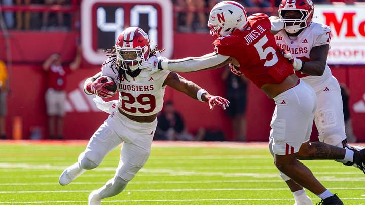 Oct 10, 2026; Lincoln, Nebraska, USA;  Indiana Hoosiers running back Lee Beebe Jr. (29) runs against Nebraska Cornhuskers defensive lineman Anthony Jones Jr. (5) during the third quarter at Memorial Stadium.  Mandatory Credit: Dylan Widger-Imagn Images