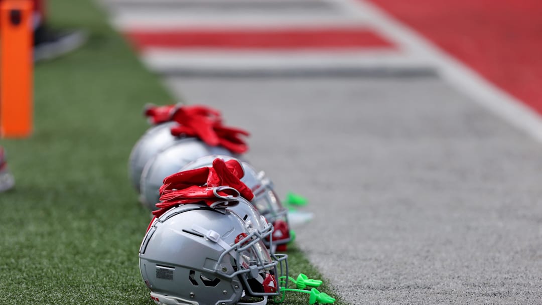 Aug 31, 2024; Columbus, Ohio, USA;  Ohio State Buckeyes helmets on the field before a game against the Akron Zips at Ohio Stadium. Mandatory Credit: Joseph Maiorana-Imagn Images