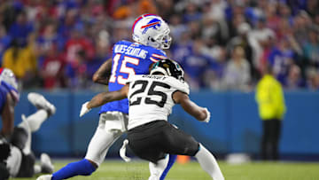 Sep 23, 2024; Orchard Park, New York, USA; Jacksonville Jaguars cornerback Ronald Darby (25) tackles Buffalo Bills wide receiver Marquez Valdes0Scantling (15) during the first half at Highmark Stadium. Mandatory Credit: Gregory Fisher-Imagn Images