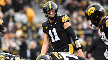Oct 25, 2025; Iowa City, Iowa, USA; Iowa Hawkeyes quarterback Mark Gronowski (11) warms up before the game against the Minnesota Golden Gophers at Kinnick Stadium. Mandatory Credit: Jeffrey Becker-Imagn Images